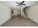 Bright and spacious living room with tile floors and a staircase at 4980 W Castle W St, Kissimmee, FL 34758