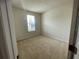 Bright bedroom with neutral walls and carpeted floor at 4980 W Castle W St, Kissimmee, FL 34758