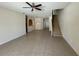 Living room with tile floor and staircase at 4980 W Castle W St, Kissimmee, FL 34758