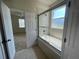 Bathroom features a large tub and sliding glass shower at 4980 W Castle W St, Kissimmee, FL 34758