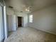 Spacious bedroom with access to bathroom and sliding door to patio at 4980 W Castle W St, Kissimmee, FL 34758