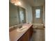 Clean bathroom, featuring a tub, toilet and vanity with mirror at 4980 W Castle W St, Kissimmee, FL 34758
