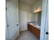 Bathroom boasts double sinks and wood cabinets at 4980 W Castle W St, Kissimmee, FL 34758