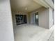 Covered patio with sliding glass doors at 4980 W Castle W St, Kissimmee, FL 34758