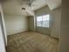 Bedroom with carpeted floor and window with blinds at 4980 W Castle W St, Kissimmee, FL 34758