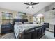 Spacious main bedroom with king-size bed and ensuite bathroom at 2971 Cayman Way, Orlando, FL 32812