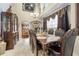 Formal dining room with a large table, chandelier, and built-in hutch at 2971 Cayman Way, Orlando, FL 32812