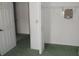 Bedroom closet with bi-fold doors and green carpet at 216 Balmoral Ct, Davenport, FL 33896