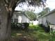 Side view of the house with lush green grass at 216 Balmoral Ct, Davenport, FL 33896