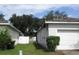 Side yard with a white fence and garage at 216 Balmoral Ct, Davenport, FL 33896