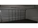 Interior of a single car garage with an automatic door at 216 Balmoral Ct, Davenport, FL 33896