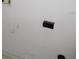 White wall with a black electrical outlet at 216 Balmoral Ct, Davenport, FL 33896
