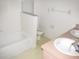 Bathroom with a tub, toilet, and double vanity at 216 Balmoral Ct, Davenport, FL 33896
