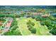 Aerial view showing home location, community amenities, and golf course at 316 Treviso Dr, Poinciana, FL 34759