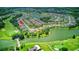 Aerial view showing home location near golf course and lake at 316 Treviso Dr, Poinciana, FL 34759