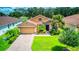 Single-Gathering home with brick driveway and landscaping at 316 Treviso Dr, Poinciana, FL 34759