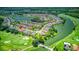 Aerial view showing home location near golf course and lake at 316 Treviso Dr, Poinciana, FL 34759