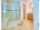 Large bathroom with walk-in shower and seat at 316 Treviso Dr, Poinciana, FL 34759