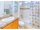 Bathroom with tub shower and wood vanity at 316 Treviso Dr, Poinciana, FL 34759
