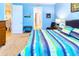 Spacious bedroom with a king-size bed and access to other rooms at 316 Treviso Dr, Poinciana, FL 34759