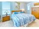 Bedroom with king-size bed, wooden furniture, and large windows at 316 Treviso Dr, Poinciana, FL 34759