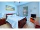 Bedroom with sleigh bed and wood furniture at 316 Treviso Dr, Poinciana, FL 34759