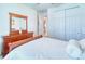 Bedroom with dresser and double bed at 316 Treviso Dr, Poinciana, FL 34759