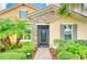 Front entryway with an iron door and stone facade at 316 Treviso Dr, Poinciana, FL 34759
