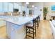 Modern kitchen with a large island and stainless steel appliances at 316 Treviso Dr, Poinciana, FL 34759