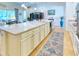 Spacious kitchen island with granite countertops and white cabinets at 316 Treviso Dr, Poinciana, FL 34759