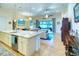 Open kitchen with a large island and stainless steel appliances at 316 Treviso Dr, Poinciana, FL 34759
