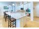Modern kitchen with an island, stainless steel appliances, and ample counter space at 316 Treviso Dr, Poinciana, FL 34759