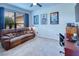 Home office with brown leather couch and desk at 316 Treviso Dr, Poinciana, FL 34759