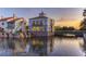 Community clubhouse and lake at sunset at 316 Treviso Dr, Poinciana, FL 34759