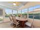 Relaxing screened porch with table and chairs, perfect for outdoor dining at 117 Ridge View Dr, Davenport, FL 33837
