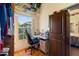 Bright home office features built-in shelving and a large window at 117 Ridge View Dr, Davenport, FL 33837