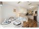 Kitchen with white cabinets and a breakfast nook at 117 Ridge View Dr, Davenport, FL 33837