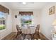 Charming breakfast nook with table and chairs, near kitchen window at 117 Ridge View Dr, Davenport, FL 33837