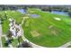 Aerial view of golf course with fairways, greens, and sand traps at 117 Ridge View Dr, Davenport, FL 33837
