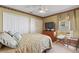 Comfortable bedroom with double bed, dresser, and closet at 117 Ridge View Dr, Davenport, FL 33837