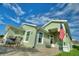 Exterior view of a light green house with a covered entryway at 117 Ridge View Dr, Davenport, FL 33837