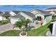 Attractive light green house with a landscaped yard and paved driveway at 117 Ridge View Dr, Davenport, FL 33837