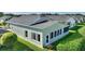 Rear view of the house showcasing a screened porch and backyard at 117 Ridge View Dr, Davenport, FL 33837
