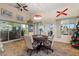 Bright sunroom with tile floors, seating area, and dining table at 117 Ridge View Dr, Davenport, FL 33837