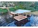 Floating dock with covered area and stairs at 19529 Dorr Rd, Altoona, FL 32702