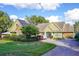 House exterior with solar panels and landscaped yard at 19529 Dorr Rd, Altoona, FL 32702