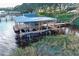 Covered boat dock with lift and lake access at 19529 Dorr Rd, Altoona, FL 32702