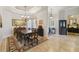 Elegant formal dining room featuring a large table, chandelier, and decorative rug at 203 Escondido Ct, Poinciana, FL 34759