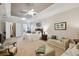 Main bedroom with sitting area and access to bath at 203 Escondido Ct, Poinciana, FL 34759