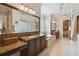 Elegant bathroom with granite countertops, soaking tub, and walk-in shower at 203 Escondido Ct, Poinciana, FL 34759